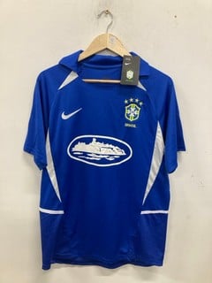 Lot 983  
            Nottingham SR9 - Delivery Only 

                
NIKE CORTEIZ BRAZIL BLUE JERSEY UK SIZE L