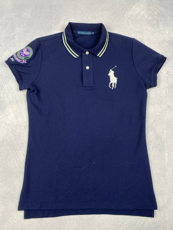 Lot 103  
            Nottingham Luxury Room - Delivery Only 

                
Polo Ralph Lauren 'The Championship Winbledon 2012' Polo Shirt - Size M (VAT ONLY...