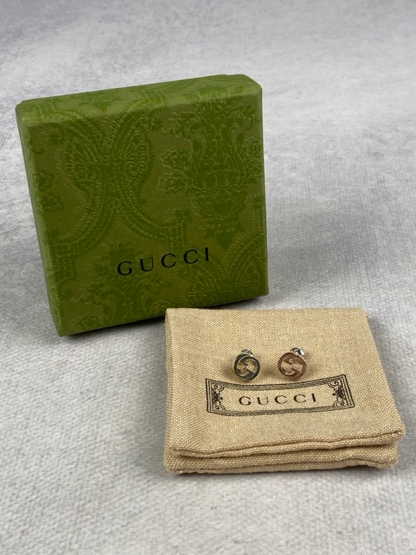 Lot 199  
            Nottingham Luxury Room - Delivery Only 

                
Gucci Silver 'GG' Earrings, Box/Dustbag (VAT ONLY PAYABLE ON BUYERS PREMIUM)