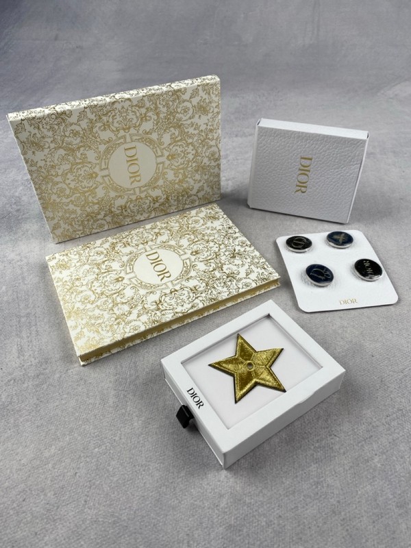 Lot 226  
            Nottingham Luxury Room - Delivery Only 

                
4 X Christian Dior Accessories To Include 4 Pin Badges - (VAT ONLY PAYABLE ON BUY...