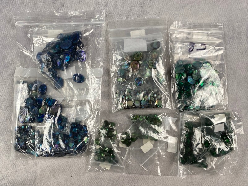 Lot 242  
            Nottingham Luxury Room - Delivery Only 

                
Five Bags of Iridescent Coloured Stones, mixed Shapes and Sizes, approx. 0.46Kg (...