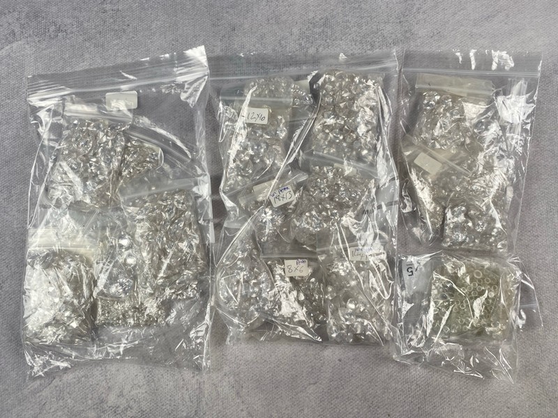 Lot 244  
            Nottingham Luxury Room - Delivery Only 

                
Four Bags of Clear Stones, mixed Shapes and Sizes, approx. 1.52Kg (VAT ONLY PAYAB...