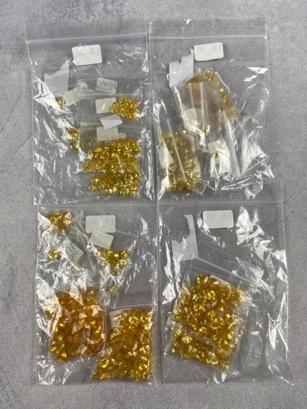 Lot 250  
            Nottingham Luxury Room - Delivery Only 

                
Four Bags of Yellow Stones, mixed Shapes and Sizes, approx. 0.34Kg (VAT ONLY PAYA...