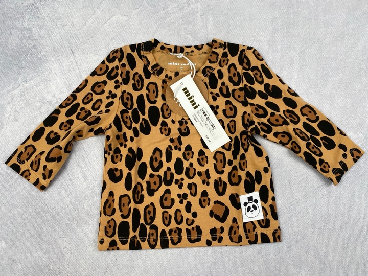 Lot 272  
            Nottingham Luxury Room - Delivery Only 

                
Mini Rodini Boys T-Shirt - Leopard Print T-Shirt. Size: 4 Months. Rrp: £42 (VAT O...