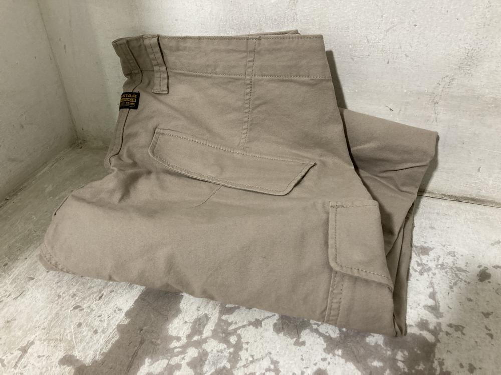 Lot 703  
            Chesterfield SR46 - Parcel Delivery Only 

                
G-STAR RAW CARGO BOTTOMS IN LIGHT BROWN - UK SIZE 38 X 34 G-STAR RAW SHIRT IN NAV... - Image 2