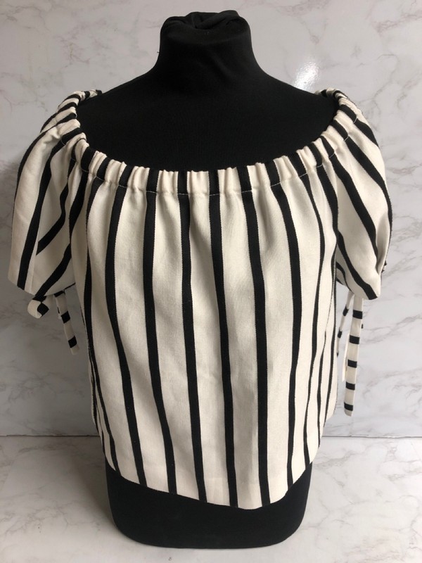 Lot 168  
            Nottingham SR5 - Delivery Only 

                
MAJE STRIPED OFF-THE-SHOULDER TOP IN WHITE PRINT VISCOSE SIZE:UK10 RRP:£33