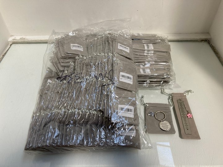 Lot 1012  
            Marchington SR13 - Parcel Delivery Only 

                
QTY OF STEP DAD THANK YOU KEYRINGS IN SILVER TO INCLUDE QTY OF COUSIN BOOKMARKS I...