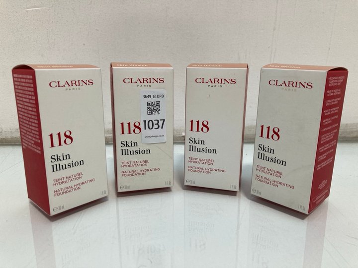 Lot 1037  
            Marchington SR13 - Parcel Delivery Only 

                
4 X CLARINS 30ML 118 SKIN ILLUSION NATURAL HYDRATING FOUNDATION IN SHADE 118 SIEN...