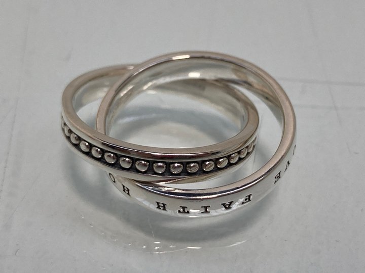 Lot 1053  
            Marchington SR13 - Parcel Delivery Only 

                
THOMAS SABO 'FAITH HOPE LOVE' INTERLOCKING RING IN SILVER - SIZE T - ORIGINAL RRP...