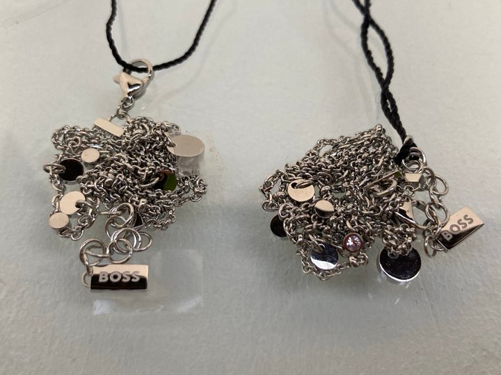 Lot 1054  
            Marchington SR13 - Parcel Delivery Only 

                
2 X HUGO BOSS WOMENS STAINLESS STEEL STACKER BRACELETS - COMBINED ORIGINAL RRP £1...