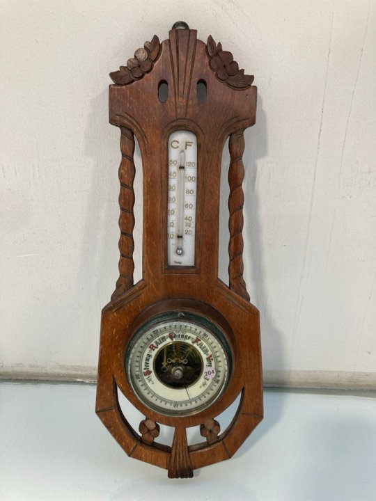 Lot 1408  
            Marchington SR13 - Parcel Delivery Only 

                
A VINTAGE WOOD MOUNTED WALL HUNG BAROMETER AND THERMOMETER: LOCATION - F11