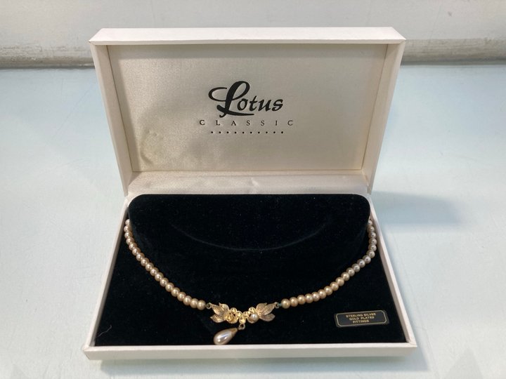 Lot 1426  
            Marchington SR13 - Parcel Delivery Only 

                
STRING OF LOTUS CLASSIC FAUX PEARLS WITH STERLING SILVER GOLD PLATED FITTINGS, IN...