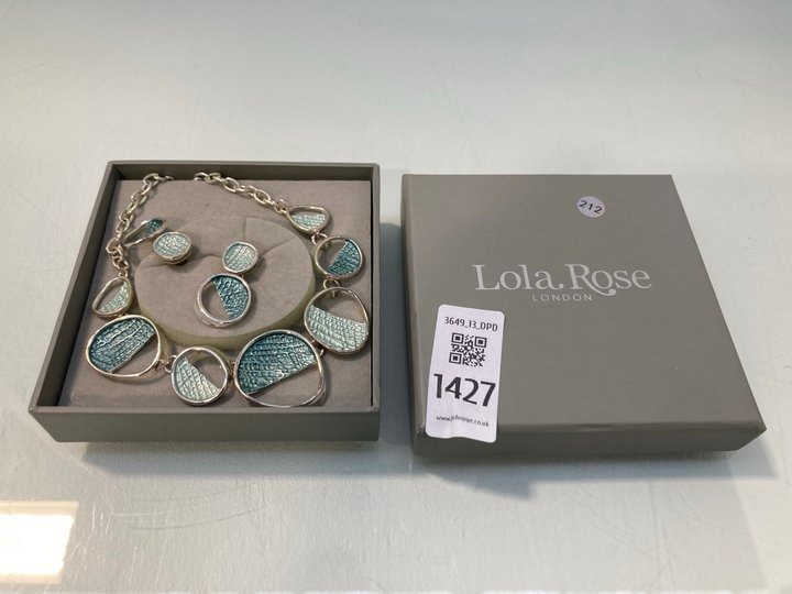 Lot 1427  
            Marchington SR13 - Parcel Delivery Only 

                
LOLA ROSE NECKLACE AND EARRING SET, WITH BOX: LOCATION - F11