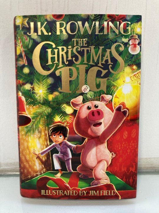Lot 1434  
            Marchington SR13 - Parcel Delivery Only 

                
J.K. ROWLING FIRST EDITION HARDBACK BOOK WITH DUSTWRAPPER, "THE CHRISTMAS PIG": L...