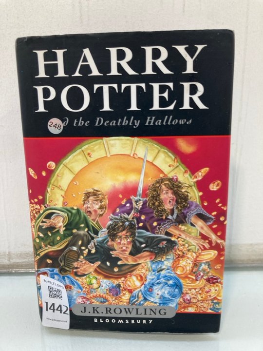 Lot 1442  
            Marchington SR13 - Parcel Delivery Only 

                
J.K. ROWLING FIRST EDITION HARDBACK BOOK WITH DUSTWRAPPER, "HARRY POTTER AND THE ...