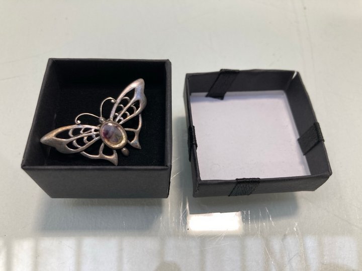 Lot 1455  
            Marchington SR13 - Parcel Delivery Only 

                
AN ANTIQUE HALLMARKED .925 SILVER BUTTERFLY BROOCH SET WITH AN OPALESCENT STONE, ...
