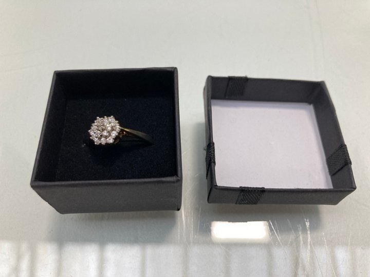 Lot 1460  
            Marchington SR13 - Parcel Delivery Only 

                
A GOLD COLOURED RING SET WITH CLEAR STONES, WITH BOX: LOCATION - F10