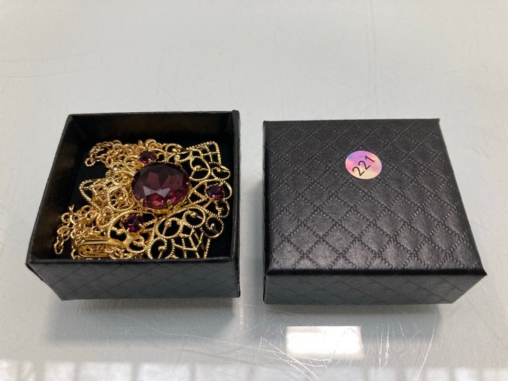 Lot 1475  
            Marchington SR13 - Parcel Delivery Only 

                
A VINTAGE GOLD COLOURED FILIGREE PENDANT SET WITH PURPLE STONES AND CHAIN, WITH B...