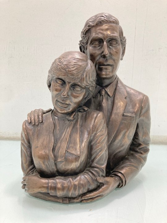 Lot 1482  
            Marchington SR13 - Parcel Delivery Only 

                
CHARLES & DIANA BRONZE COLOURED BUSTIER FIGURE: LOCATION - F10