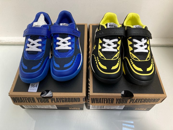 Lot 964  
            Marchington SR13 - Parcel Delivery Only 

                
2 X PAIRS OF CLARKS CHILDRENS CICA STAR FLEX TRAINERS IN BLACK COMBI AND BLUE COM...