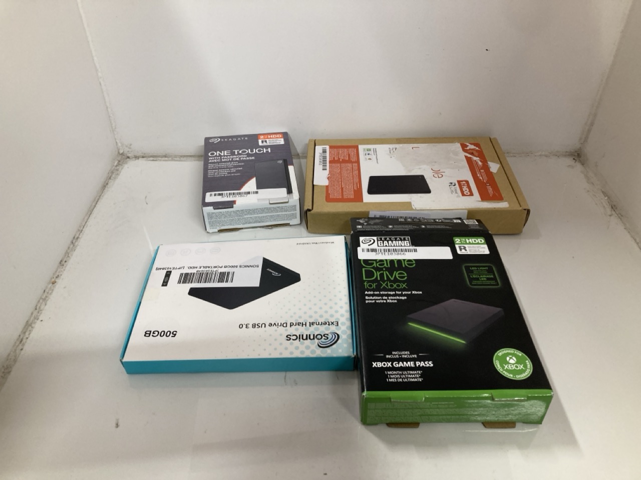 Lot 708  
            Edinburgh SR33 - Delivery Only 

                
X4 ASSORTED PORTABLE HARD DISC DRIVES TO INCLUDE SEAGATE 2TB GAME DRIVE FOR XBOX ...