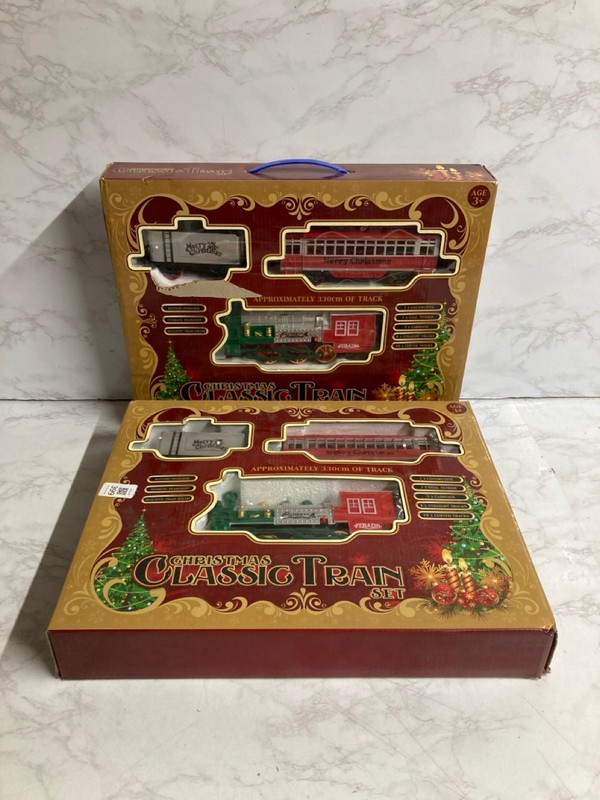 Lot 399  
            Nottingham SR5 - Delivery Only 

                
2 X CHRISTMAS CLASSIC TRAIN SETS