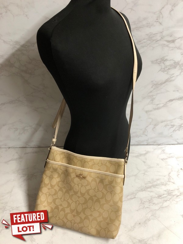Lot 47  
            Nottingham SR5 - Delivery Only 

                
COACH SIGNATURE ZIP FILE CROSSBODY BAG