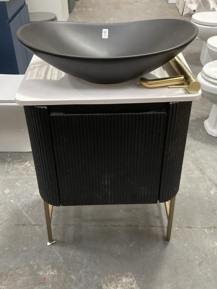 Lot 65  
            Chesterfield SR39 - Collection 

                
SCUDO LINEA CURVE MATT BLACK CABINET WITH BLACK VESSEL BASIN AND BRUSHED BRASS FR...