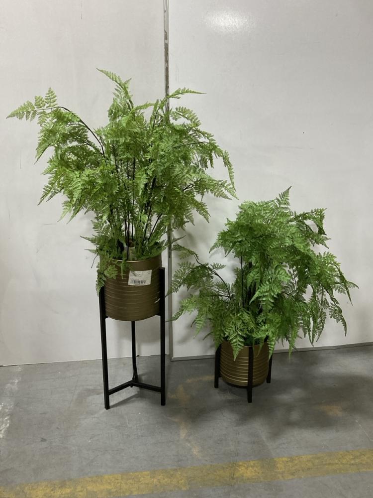 Lot 100  
            Chesterfield SR38 - Collection 

                
DFS ARTIFICIAL PLANT IN GOLD STYLE PLANT POT ON TALL BLACK STAND TO INCLUDE DFS A...