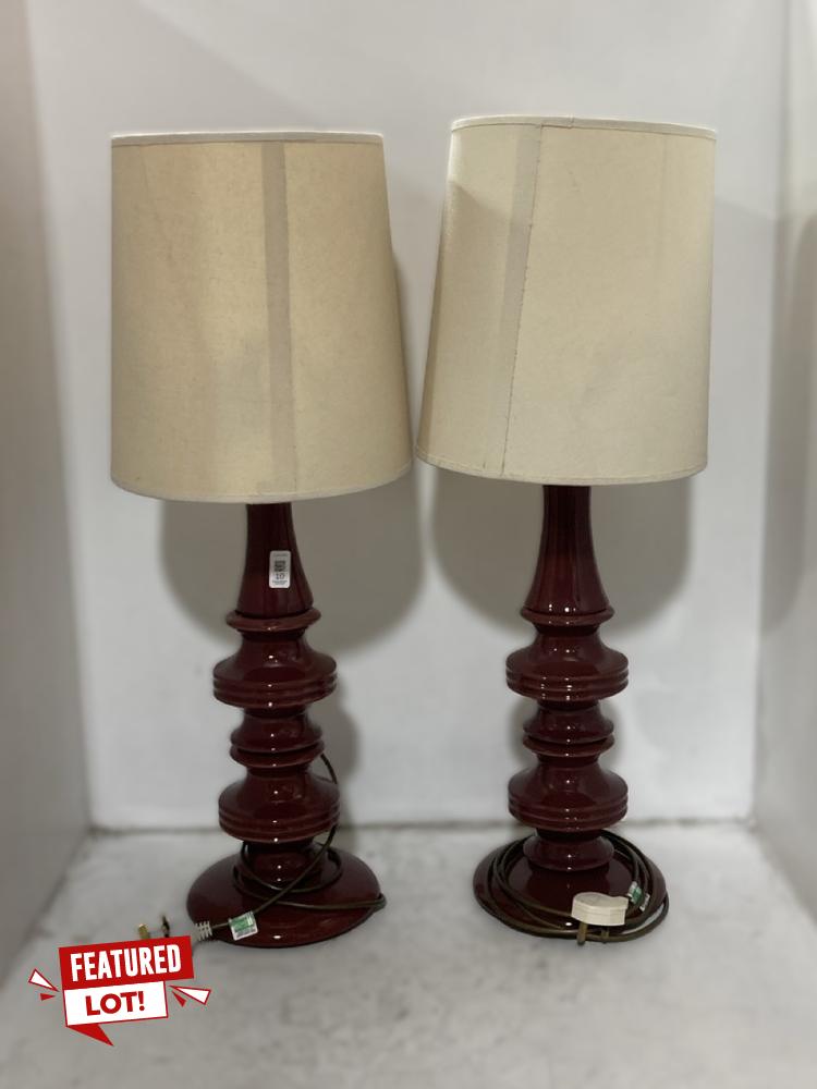 Lot 10  
            Chesterfield SR38 - Collection 

                
2 X DFS PAGODA STYLE TABLE LAMP IN WINE RED WITH CREAM LAMP SHADE (COLLECTION ONL...