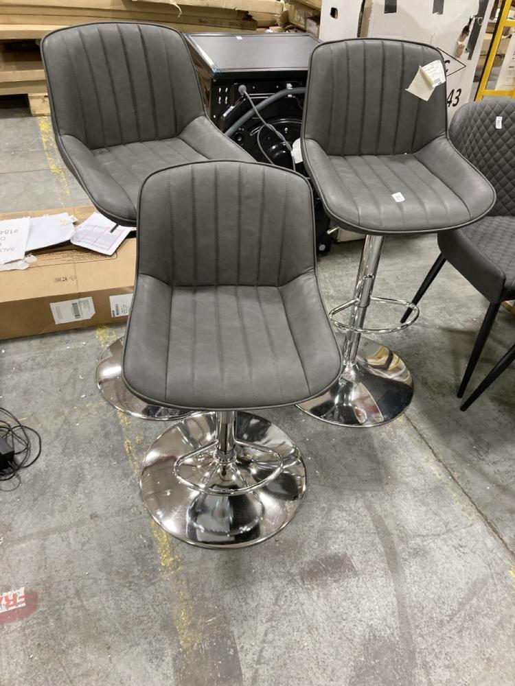 Lot 861  
            Chesterfield SR38 - Collection or Optional Delivery Available 

                
SET OF 3 FLUTED BAR STOOLS IN GREY LEATHER STYLE FINISH (LOCATION: SR38 A9)