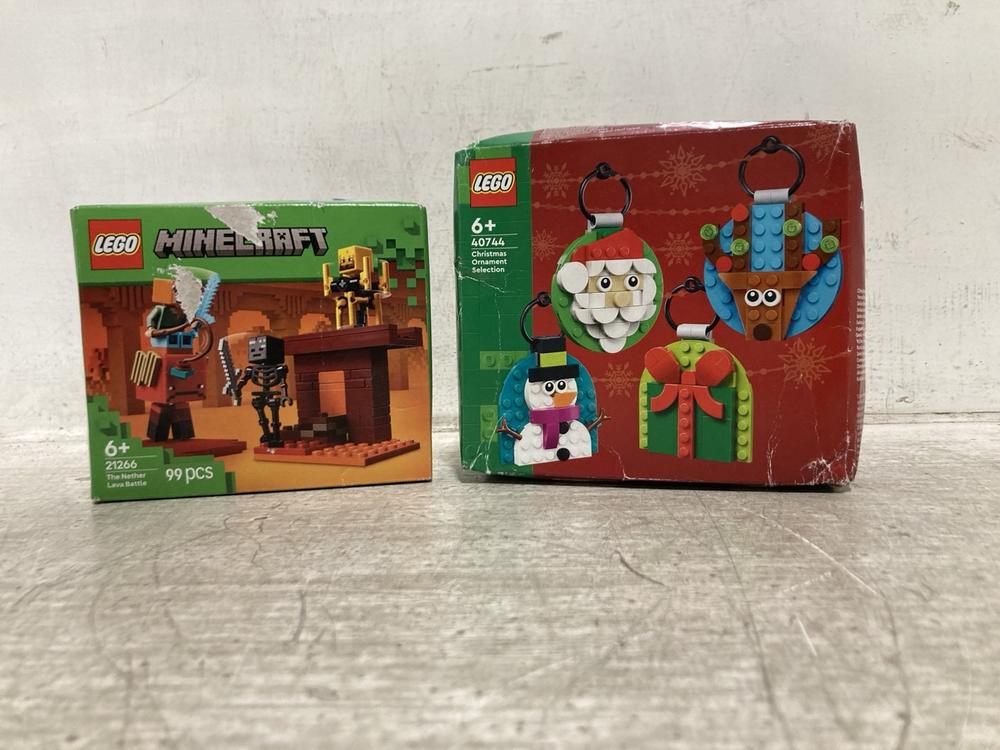 Lot 901  
            Chesterfield SR45 - Parcel Delivery Only 

                
LEGO MINECRAFT THE NETHER LAVA BATTLE 21266 TO INCLUDE LEGO CHRISTMAS ORNAMENT SE...