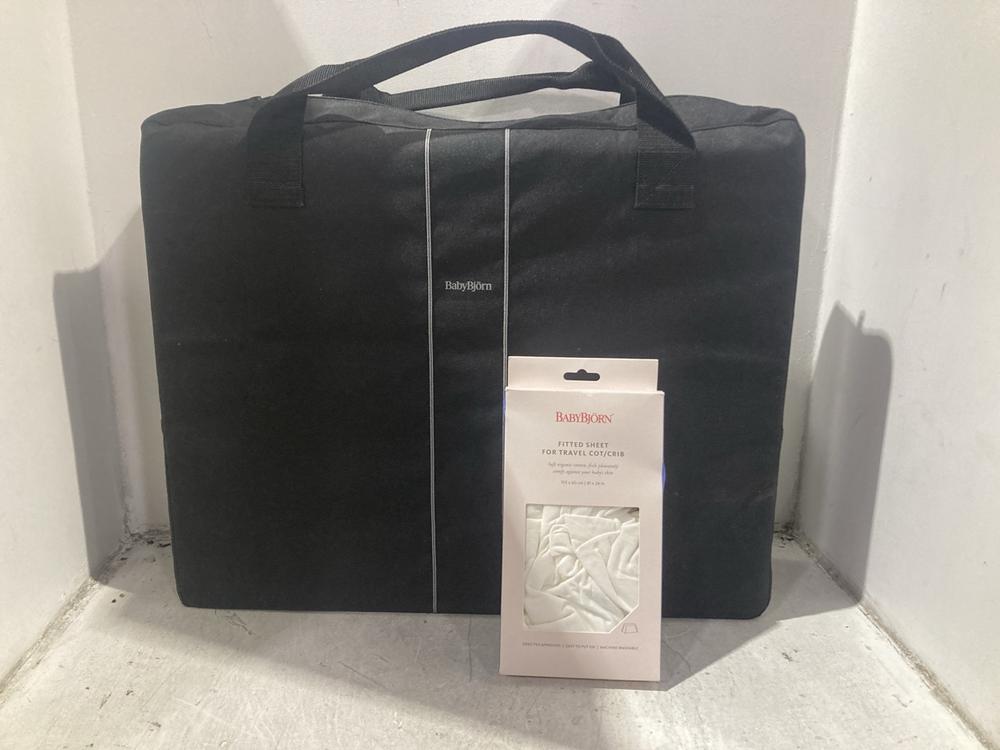 Lot 1505  
            Chesterfield SR44 - Parcel Delivery Only 

                
BABY BJORN TRAVEL COT CRIB TO INCLUDE FITTED SHEET FOR TRAVEL COT CRIB (LOCATION:...