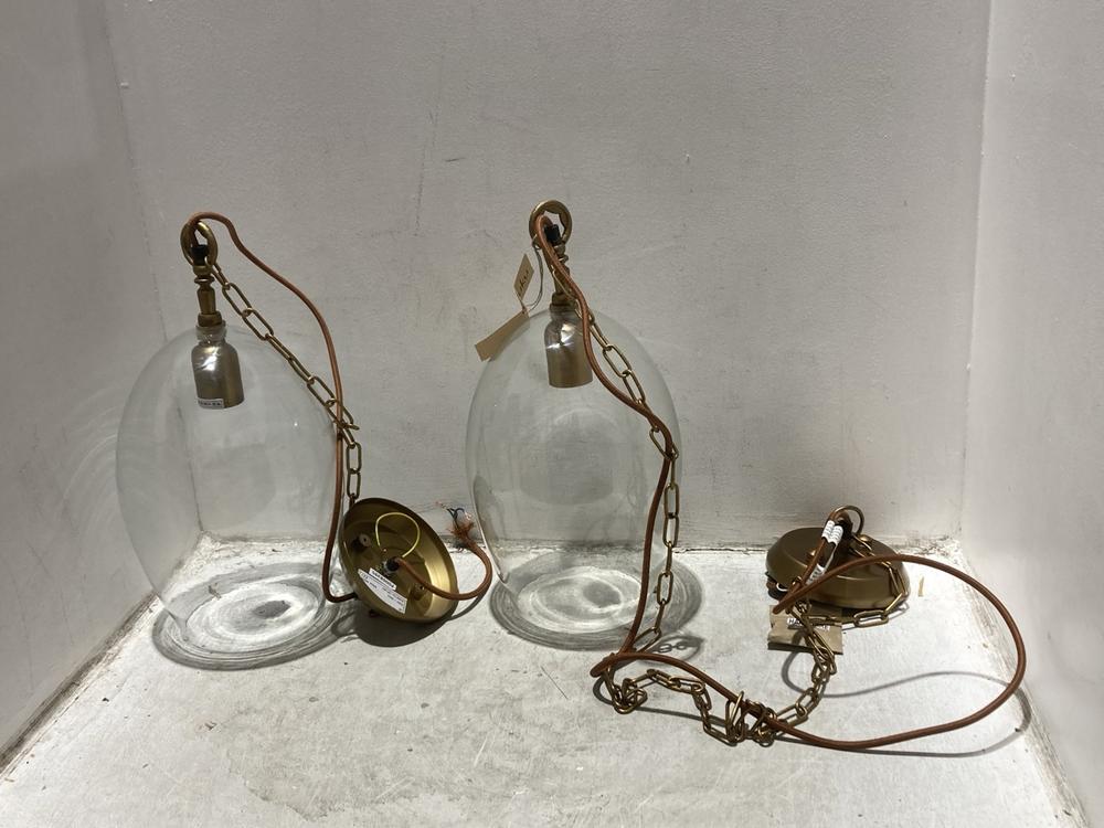Lot 154  
            Chesterfield SR44 - Parcel Delivery Only 

                
2 X NKUKU OTORO RECYCLED GLASS PENDANT - CLEAR - SMALL OVAL - ITEM NO. OP1401 - O...
