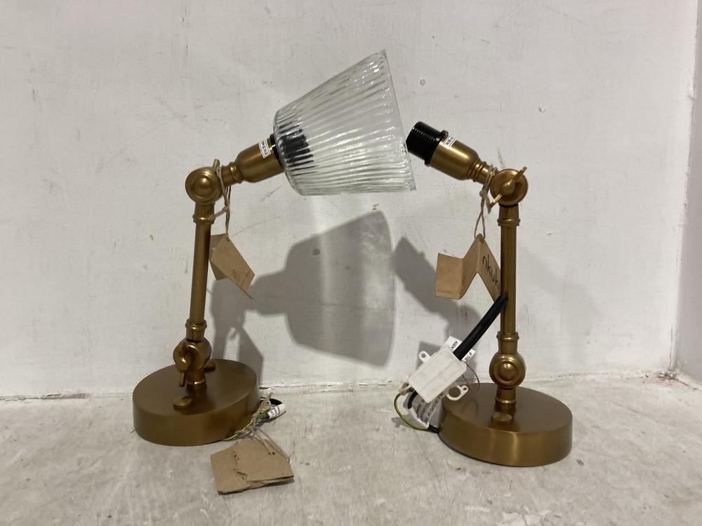 Lot 56  
            Chesterfield SR44 - Parcel Delivery Only 

                
NKUKU DAVIKA RIBBED GLASS TASK WALL LAMP - CLEAR & ANTIQUE BRASS - ITEM NO. DL610...