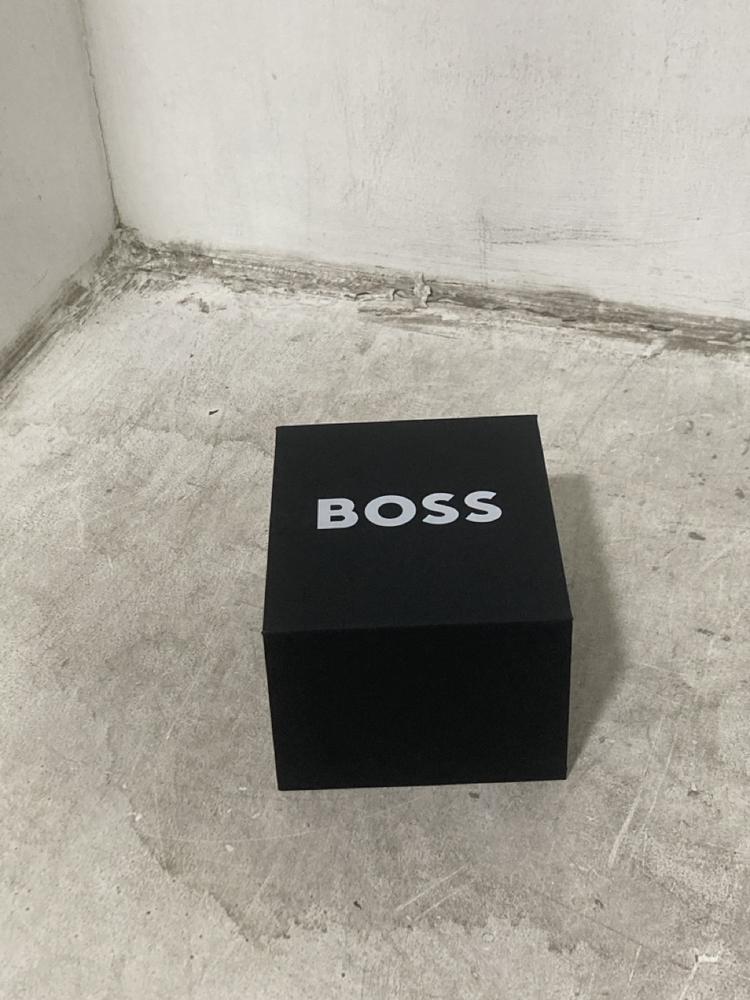 Lot 705  
            Chesterfield SR44 - Parcel Delivery Only 

                
BOSS TACHYMETER BLACK AND GOLD STAINLESS STEEL WATCH (LOCATION: E5)