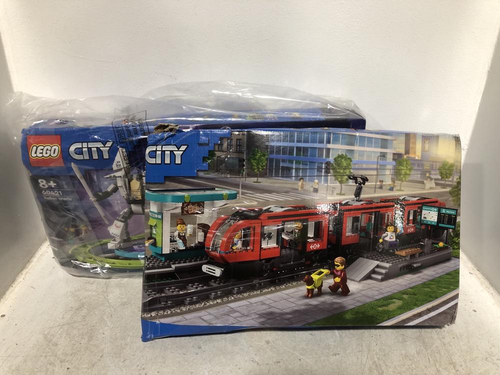 Lot 571  
            Chesterfield SR46 - Parcel Delivery Only 

                
LEGO CITY 60423 DOWNTOWN TRAM SET TO INCLUDE LEGO CITY 60421 ROBOT WORLD SET (LOC...