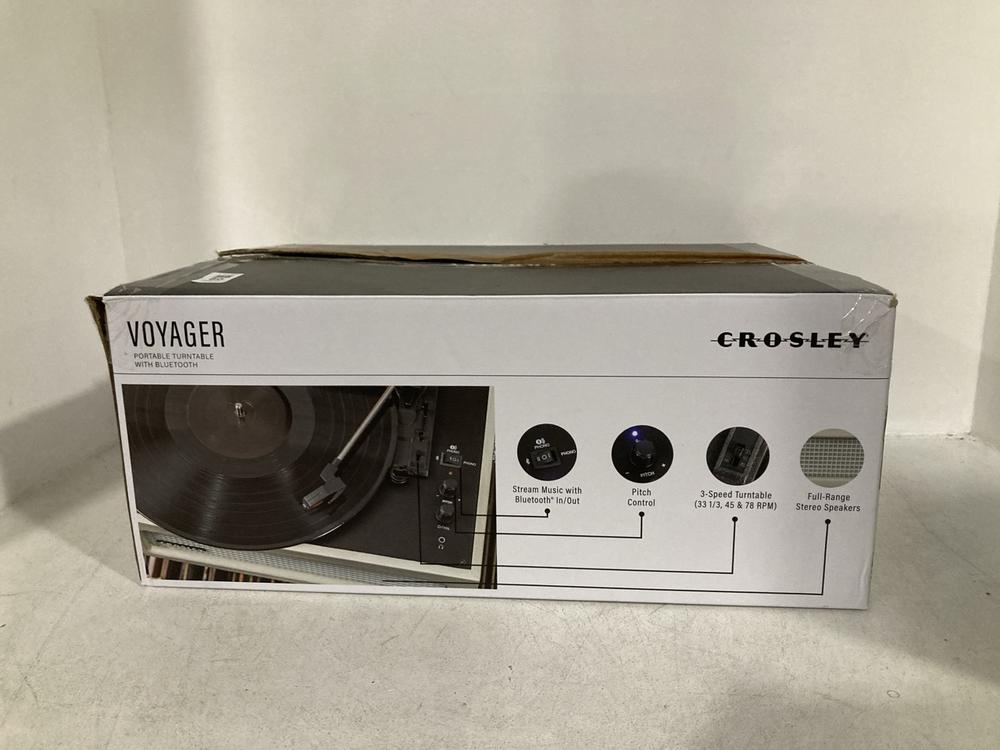 Lot 80  
            Chesterfield SR46 - Parcel Delivery Only 

                
CROSLEY CR80178 VOYAGE PORTABLE TURNTABLE RECORD PLAYER - APPROX ORIGINAL RRP £10...