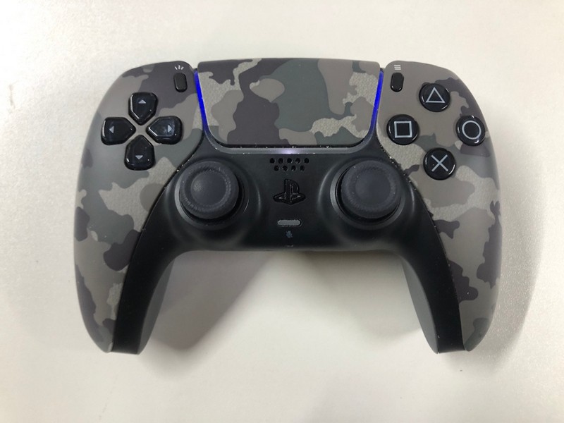 Lot 47  
            Nottingham SR1 - Delivery Only 

                
PLAYSTATION 5 DUAL SENSE WIRELESS CONTROLLER - GREY CAMO - ORIGINAL RRP - £74.99