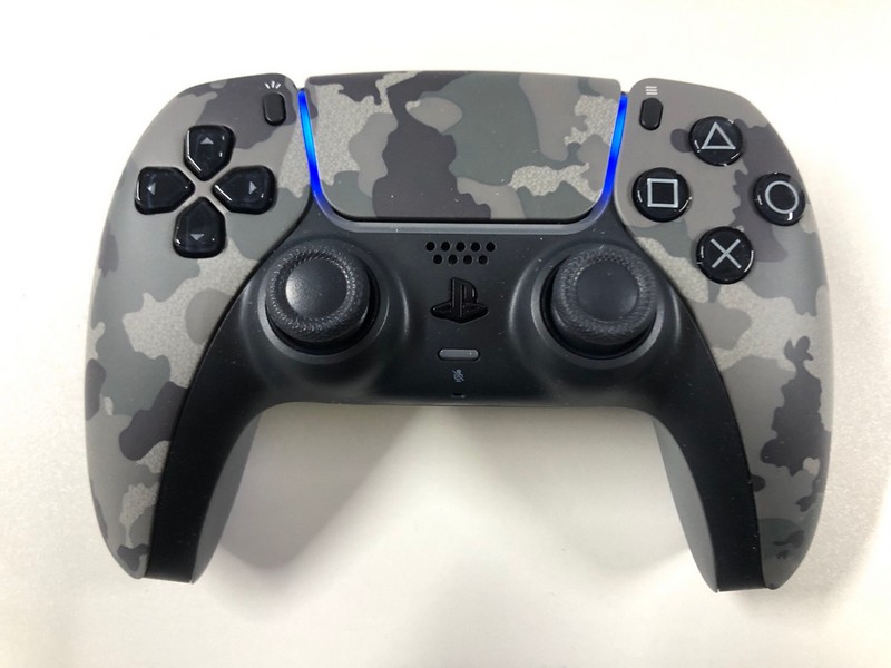 Lot 51  
            Nottingham SR1 - Delivery Only 

                
PLAYSTATION 5 DUAL SENSE WIRELESS CONTROLLER - GREY CAMO - ORIGINAL RRP - £74.99