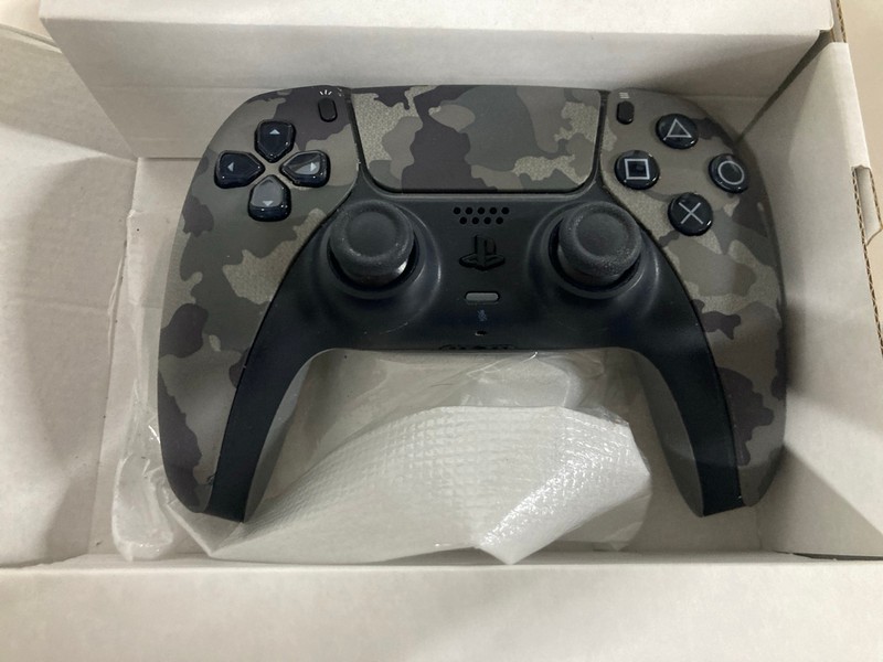 Lot 639  
            Nottingham SR1 - Delivery Only 

                
PLAYSTATION 5 DUAL SENSE WIRELESS CONTROLLER - GREY CAMO - ORIGINAL RRP - £74.99