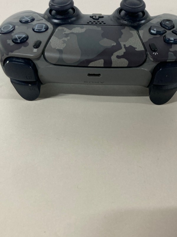Lot 641  
            Nottingham SR1 - Delivery Only 

                
PLAYSTATION 5 DUAL SENSE WIRELESS CONTROLLER - GREY CAMO - ORIGINAL RRP - £74.99
