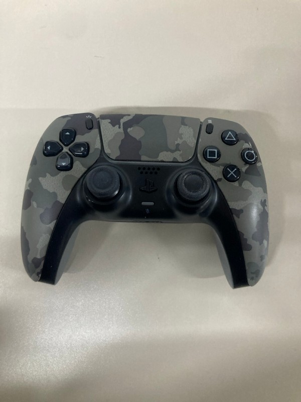 Lot 642  
            Nottingham SR1 - Delivery Only 

                
PLAYSTATION 5 DUAL SENSE WIRELESS CONTROLLER - GREY CAMO - ORIGINAL RRP - £74.99