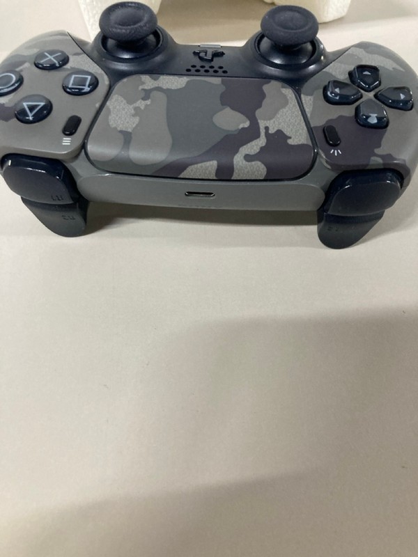 Lot 642  
            Nottingham SR1 - Delivery Only 

                
PLAYSTATION 5 DUAL SENSE WIRELESS CONTROLLER - GREY CAMO - ORIGINAL RRP - £74.99