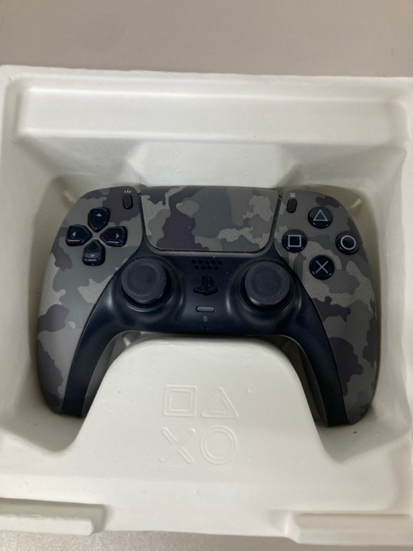 Lot 643  
            Nottingham SR1 - Delivery Only 

                
PLAYSTATION 5 DUAL SENSE WIRELESS CONTROLLER - GREY CAMO - ORIGINAL RRP - £74.99