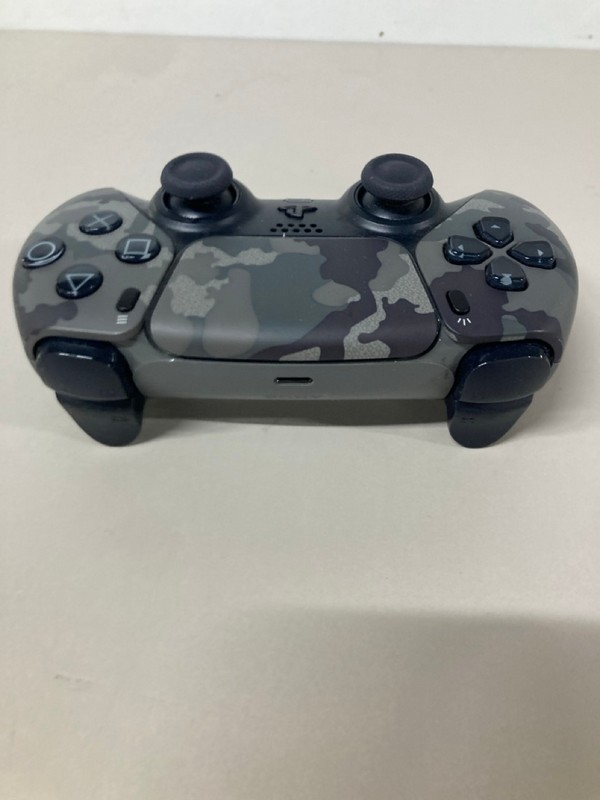 Lot 643  
            Nottingham SR1 - Delivery Only 

                
PLAYSTATION 5 DUAL SENSE WIRELESS CONTROLLER - GREY CAMO - ORIGINAL RRP - £74.99