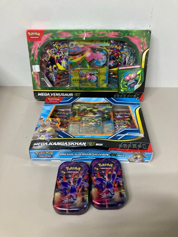 Lot 669  
            Nottingham SR1 - Delivery Only 

                
4 X POKÉMON CARD TINS/BOX SETS INC. MEGA KANGASKHAN EX BOX