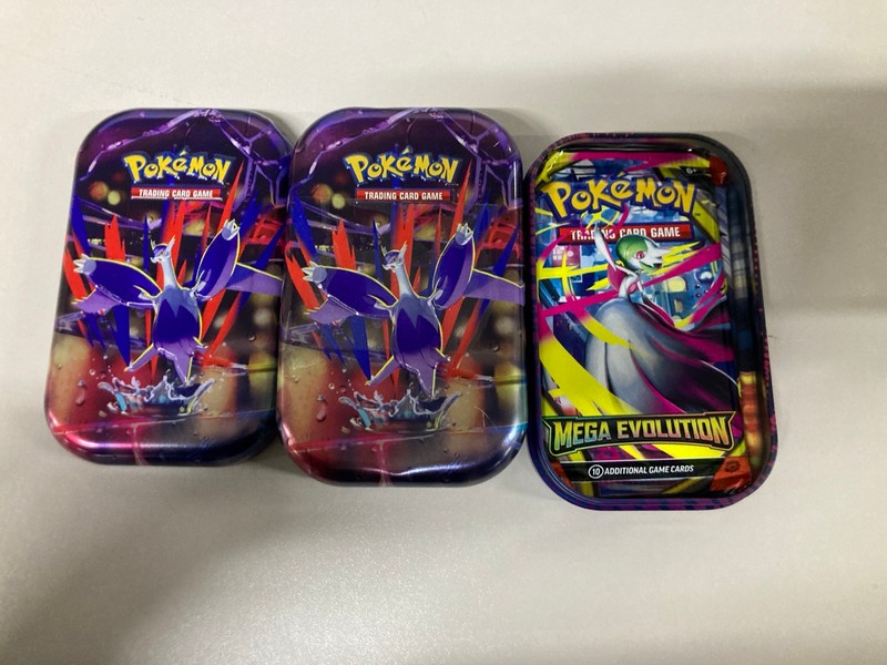 Lot 669  
            Nottingham SR1 - Delivery Only 

                
4 X POKÉMON CARD TINS/BOX SETS INC. MEGA KANGASKHAN EX BOX