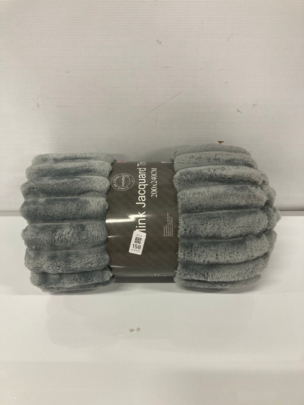 Lot 158  
            Nottingham SR9 - Delivery Only 

                
MINK JACQUARD GREY FLUFFY THROW