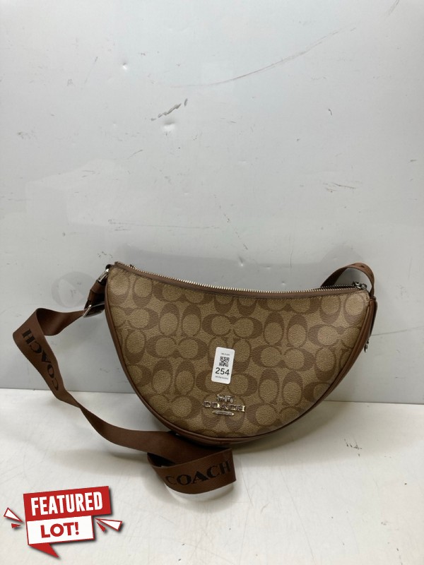 Lot 254  
            Nottingham SR9 - Delivery Only 

                
COACH BROWN LOGO CROSSBODY BAG